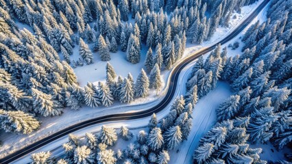 Wall Mural - Aerial view of snowy mountain road winding through winter landscape, mountain, road, aerial view, winter, snow, winding, curve