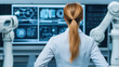 © Nattapol - Confident woman observing advanced technology in high tech automation lab, surrounded by robotic arms and digital displays
