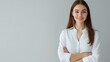 © WS Studio 1985 - Young Businesswoman Smiling at the Camera in a Bright, Minimalist Portrait Setting Showcasing Professionalism and Confidence with a Soft Color Palette