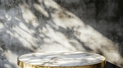 Poster - A round marble table top with a gold rim sits in front of a textured concrete wall with sunlight and shadows casting patterns.