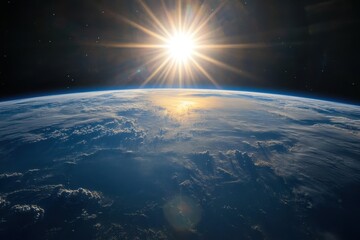 Wall Mural - a bright, shining sun rises over the earth, casting its light on the planet's clouds and atmosphere.