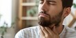 © Masque - Unwell Man Expresses Sore Throat Discomfort
