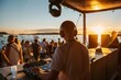 © Masque - DJ Spinning Tunes at Sunset Event