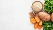 © Thritti - Minimalist flat lay of brown rice, sweet potatoes, and legumes, symbolizing clean carbs for a balanced lifestyle, clean carbohydrates, healthy diet