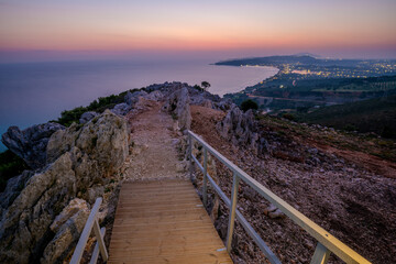 Wall Mural - sunrise over the island of zakhyntos from a vantage point on the rocks