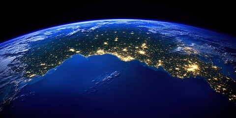 Wall Mural - A Stunning Aerial View of Earth at Night Showcasing Twinkling City Lights Over Coastal Areas and the Deep Blue Ocean in a Captivating Image of Our Planet from Space