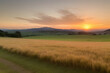 © ADS - A vibrant sunset paints the sky with hues of orange, yellow, and pink, casting a warm glow over rolling hills and a lush, green meadow. The sun dips below the horizon, leaving a trail of light across