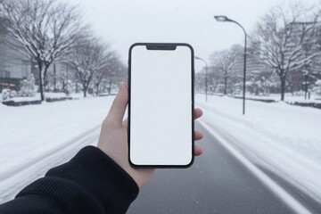 Wall Mural - Stylish Smartphone in Snowy Cityscape