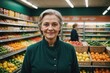 © ThomasLENNE - Close portrait of a smiling senior Russian female grocer standing and looking at the camera, Russian grocery store blurred background