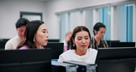 Business, advice and women at computer for training, teamwork and development in office together. Technology, coworking and Japanese people with help for online course, productivity and management