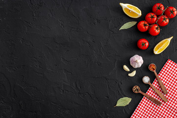 Wall Mural - Cooking concept with tomatoes and chili peppers, vegetables spices on the kitchen desk top