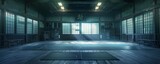 Vacant martial arts dojo, with dim lighting setting the stage for discipline and skill.