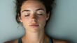 © AiAbstract - Serene Young Woman Resting in a Calm Space After Yoga Class with Eyes Closed, Embracing Inner Peace and Relaxation, Close-Up Shot of a Meditative Moment