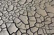 © Silviu - A riverbed dried up and cracked soil due to the lack of water and precipitation but also very high temperatures. Dried up river.