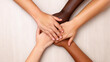© pkproject - Hands Joining Together on Table Symbolizing Teamwork and Trust in Business
