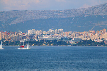 Wall Mural - Contemporary buildings, gardens and beaches at the waterfront in Split, Croatia. View of Split from the boat.