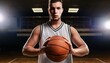 © dmnkandsk - A male basketball player holding a ball in the court, arena