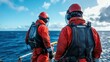 ©  Shomixer - Workers in red safety attire on an offshore platform gazing toward the ocean horizon, symbolizing anticipation and commitment in marine exploration service.