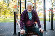 © Marko Geber - Portrait of a senior man exercising at outdoor fitness park in autumn