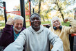 © Marko Geber - Senior friends taking a selfie after a group workout at an outdoor park