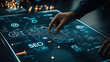 © 220 AI Studio - hand interacting with digital SEO interface on touchscreen display
