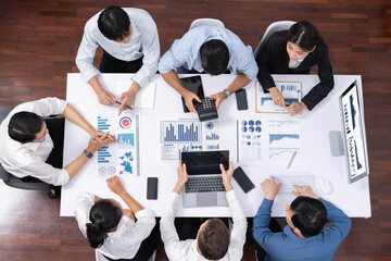 Aufkleber - Top view analyst team utilizing BI Fintech to analyze financial data at table in meeting room. Analytic BI dashboard power on paper for business insight and strategic marketing planning. Prudent
