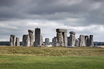 Stonehenge in England beneath a cloudy sky.