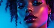 © fashion world - Portrait of a beautiful woman with makeup and glossy lips in neon light.