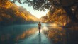 © Umi Sakina - A lone figure walks along a riverbank at sunrise, surrounded by trees and fog.
