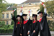 © New Africa - Happy students with diplomas after graduation ceremony outdoors