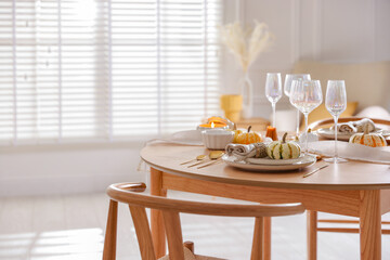 Poster - Stylish table setting with beautiful dishware and autumn decor in dining room