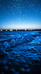 Wall Mural - mesmerizing view of ocean waves gently rolling under a starry night sky, with a dreamy blurred backg