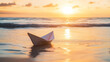 © myjadeite - a small paper boat is floating near at shallow end of the beach - ready for new journey