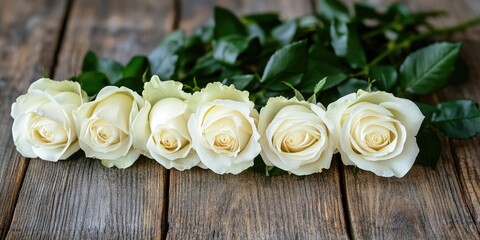Leinwandbilder - White roses on a wooden surface. Selective focus, copy space.
