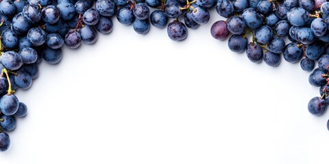 Poster - Grape berries. Grape berries placed on a blank (white) background, arranged at both the top and bottom, with copyspace. Top view.