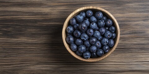 Aufkleber - Blueberries in a circular wooden bowl on a wooden surface copy space.