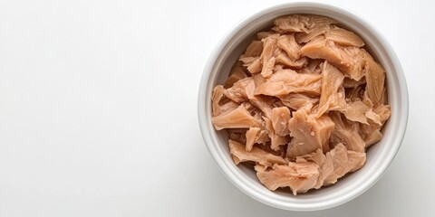 Aufkleber - Canned tuna in a white bowl, set against a white background; top view, copy space, soft lighting, studio shot.