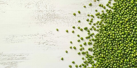 Poster - Raw green mung beans on a white wooden background, top view. Copy space.