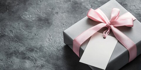 Aufkleber - Silver gift box with a pink ribbon and a white blank gift tag on a gray background. Area for your text.