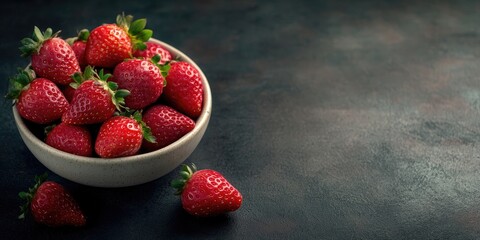 Poster - Fresh, ripe strawberries in a bowl on a dark background. Copyspace.