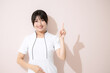 © kapinon - Esthetician, beauty nurse, and other points and recommended poses Pink background, looking at the camera