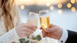 © Jiraphiphat - valentine date night sweetness concept, A romantic toast between a couple with glasses of champagne, set against a soft, glowing backdrop.