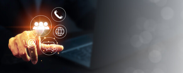 Contact us concept, Businessman using laptop and pointing icon customer service call center.