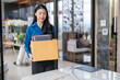 © Charlie's - Quit Job asian business woman sending resignation letter and packing Stuff Resign Depress or carrying business cardboard box in office. Change of job or fired from company