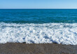 © Alex - High tide in the mediterranean sea,ripple water with sea foam