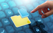 © tadamichi - Business files and folders storing in document management system DMS server. Businessman touching file and folder icon on many files.