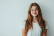 © Maria A - Portrait of smiling young girl with long red hair against a light background, International Day of Women and Girls in Science, highlighting potential, inspiration for future STEM leaders