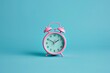 © Marina Demidiuk - Vintage Pink Alarm Clock on a bright Turquoise Background. Retro alarm clock on a light blue backdrop. Nostalgic. Deadline time concept. Daily routine. 70s Retro Plastic Clock. Time management