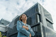 © StockPhotoRepublic - Young Businesswoman Using Digital Tablet In Front A Modern Office Building in a Financial District