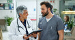© peopleimages.com - Doctor, man and woman with tablet for advice, hospital management and consulting together. Healthcare, professional and medical team with digital app for online schedule, agenda or report in clinic